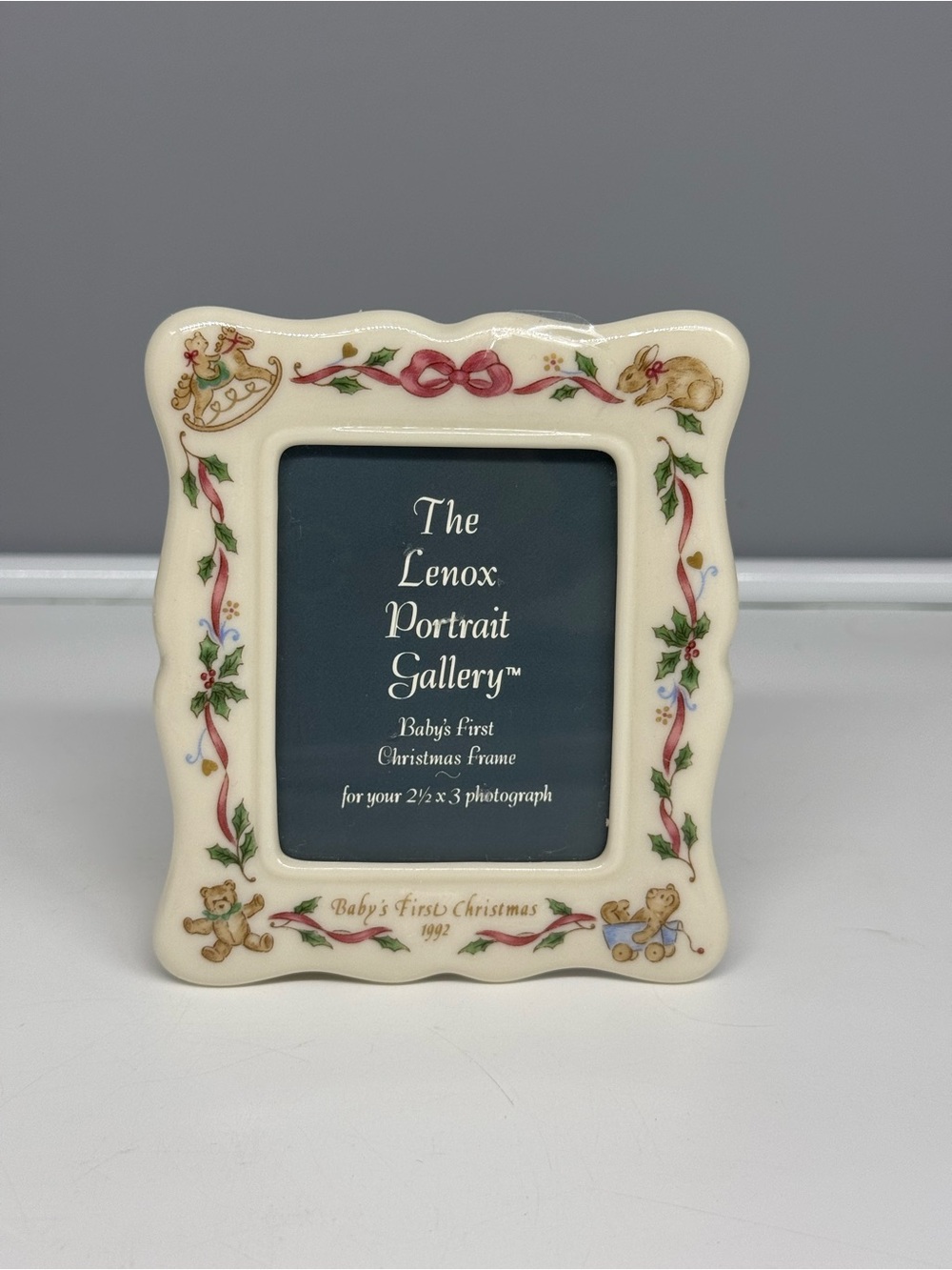 Lenox Portrait Gallery Baby's First Christmas 1991 frame holds a 2.5 x 3” photo
